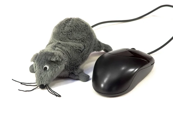 Ratón de ordenador y un juguete — Foto de Stock