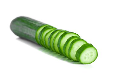 Cucumber and slices isolated over white background clipart