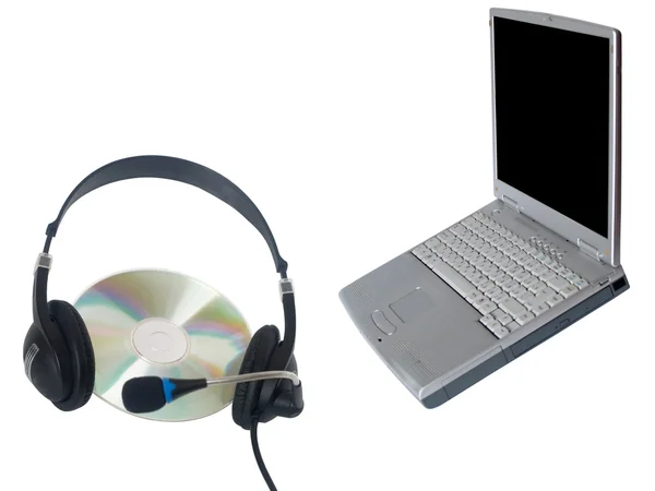 Přenosný počítač, sluchátka a disk — Stock fotografie