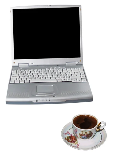 Den bärbara datorn och en kopp från kaffe — Stockfoto