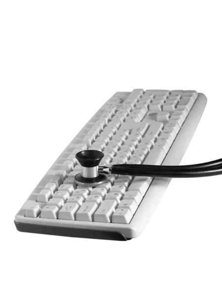 Die Tastatur und das Phonendoskop — Stockfoto