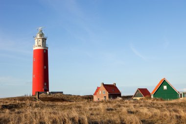 Lighthouse before blue sky clipart