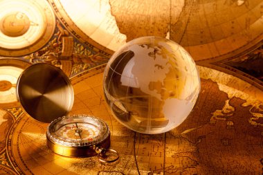 Gold globe and compass clipart