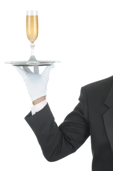 Butler med champagne på bricka — Stockfoto