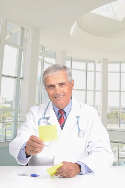Doctor handing prescription — Stock Photo, Image