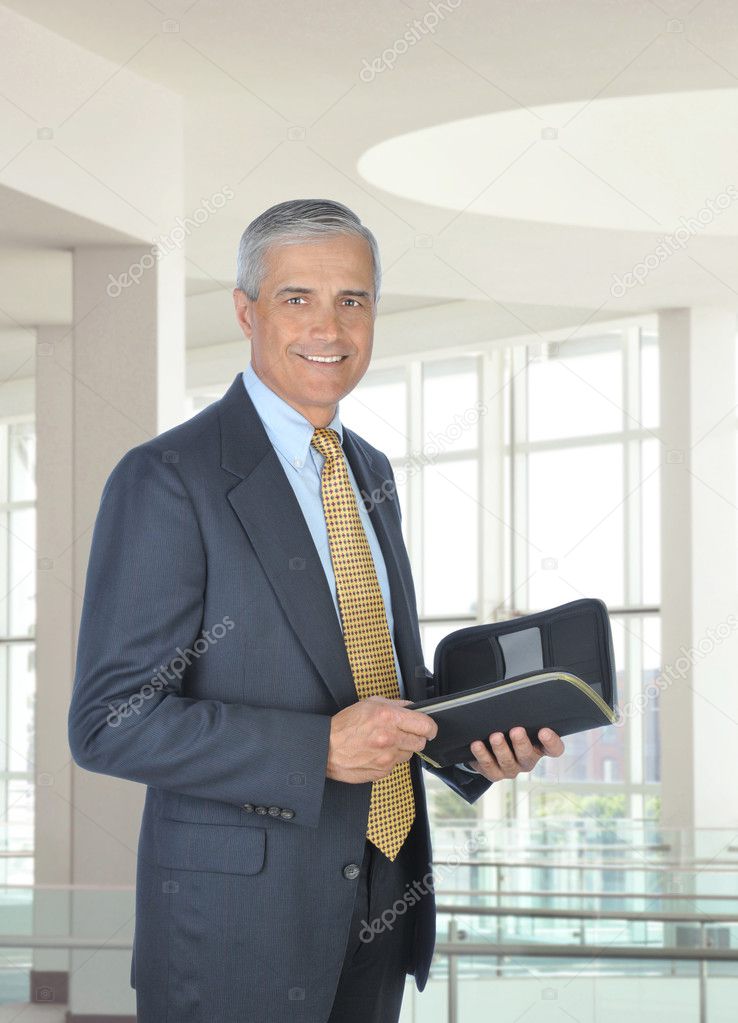 Smiling Businessman with Planner