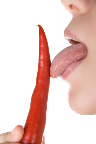 Licking chili pepper — Stock Photo, Image