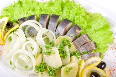 Herring with vegetables clipart