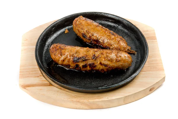 Sausages at pan with sauce — Stock Photo, Image