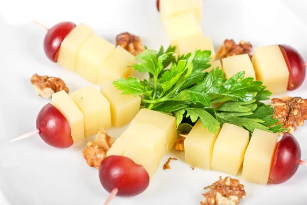Cheese and grapes and nuts — Stock Photo, Image