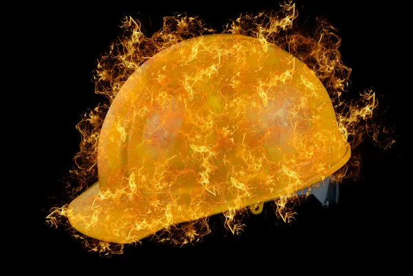 Gele helm op brand — Stockfoto