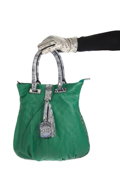 Зеленая сумка под рукой — стоковое фото