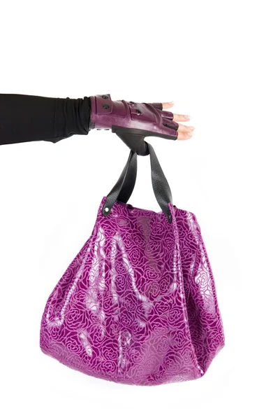 Пурпурная сумка под рукой — стоковое фото