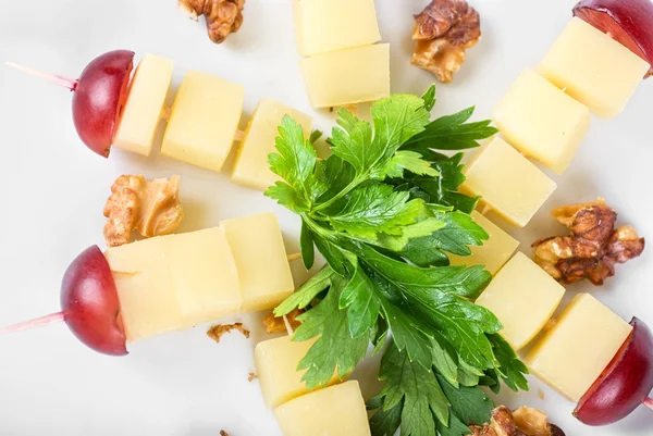 Cheese and grapes and nuts — Stock Photo, Image