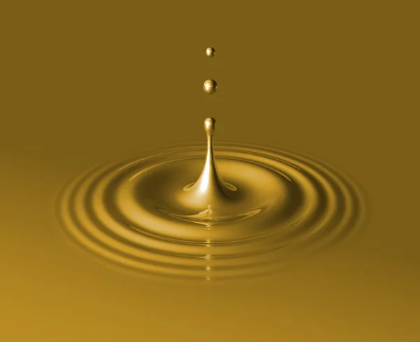 Drop of liquid gold and ripple — Stock Photo, Image