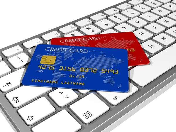 Cartões de crédito em um teclado de computador — Fotografia de Stock