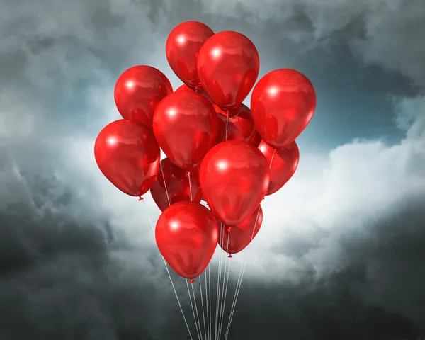 Czerwone balony na zachmurzone niebo dramatyczne — Zdjęcie stockowe