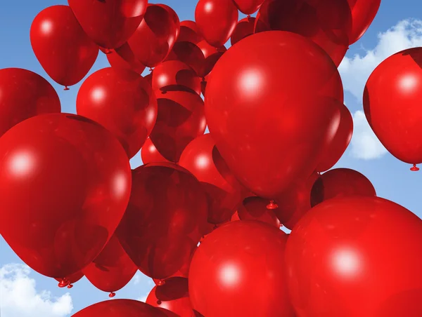Röda ballonger på en blå himmel — Stockfoto