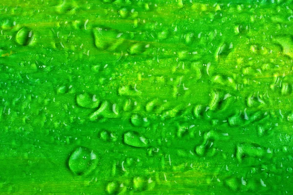 Water drops on green textured background — Stock Photo, Image
