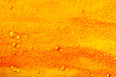 Water drops on orange painted background clipart