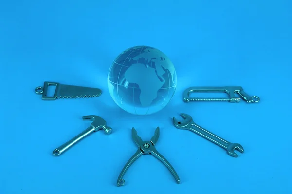 Globe and work tools — Stock Photo, Image