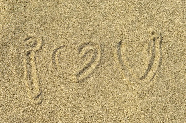 "Miluji tě "v písku — Stock fotografie