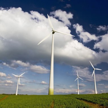 Windmills against a blue sky clipart