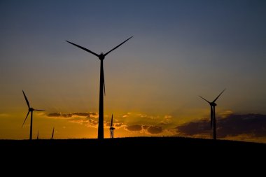 Windmills at sunset clipart