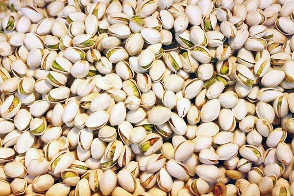 Bakgrund av läckra pistagenötter. — Stockfoto