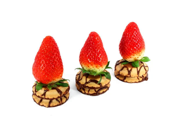 Three fresh strawberries on a cakes — Stock Photo, Image