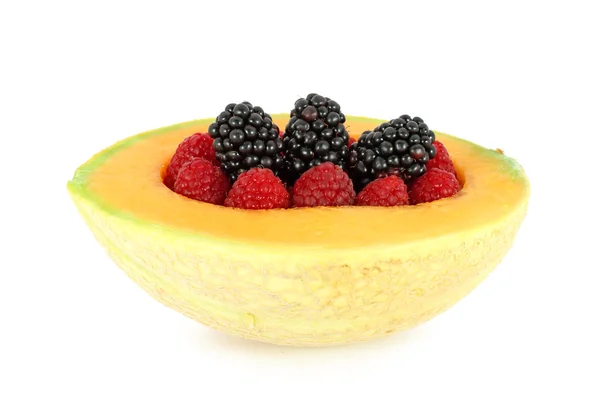 Blackberry and raspberry in melon — Stock Photo, Image