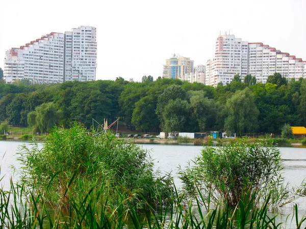 stock image City park with a lake and high buildings