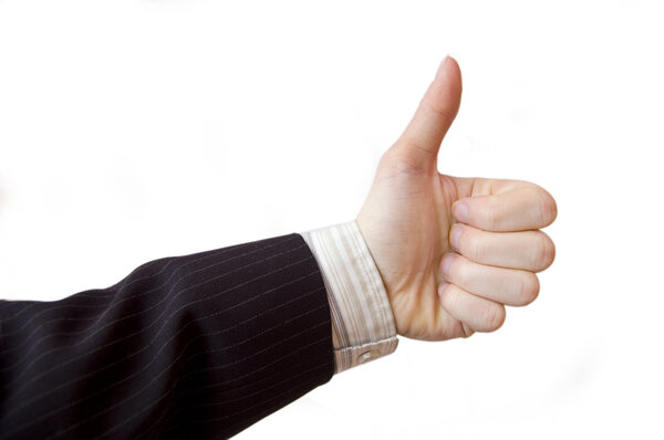 Success in business. Businessman hand shows the sign of victory.