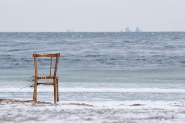 Chair washed ashore and Barsebäck in the background clipart