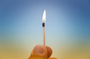 Hand with a match clipart