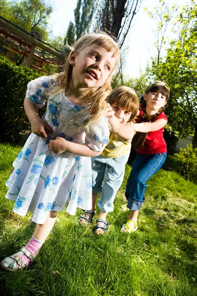 Girls with boy in park — Stock Photo, Image