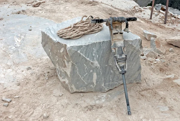 Pneumatic drill in marble quarry — Stock Photo, Image