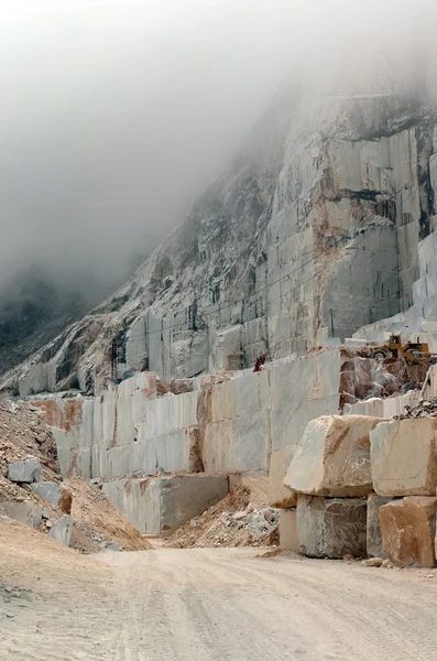 High altitude quarry with digger — Stock Photo, Image