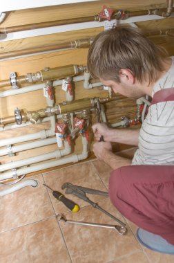Plumber at work clipart