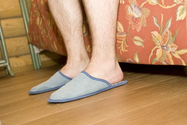Man's legs in slippers — Stock Photo, Image