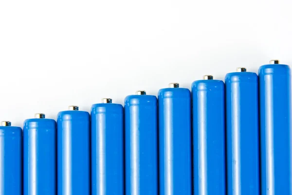 Rij van blauwe batterijen — Stockfoto