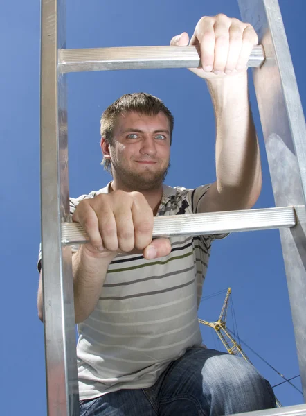 Man climbing ladder — Stock Photo, Image
