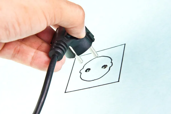 Plugging electrical cable to sketching socket — Stock Photo, Image