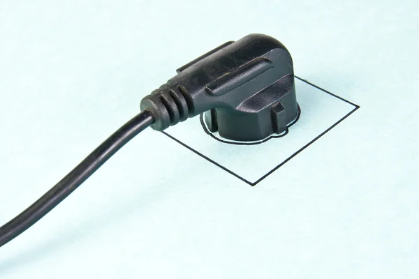Electrical plug in drawn socket — Stock Photo, Image