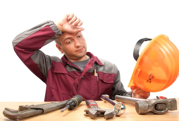 Hombre trabajador cansado con herramientas — Foto de Stock