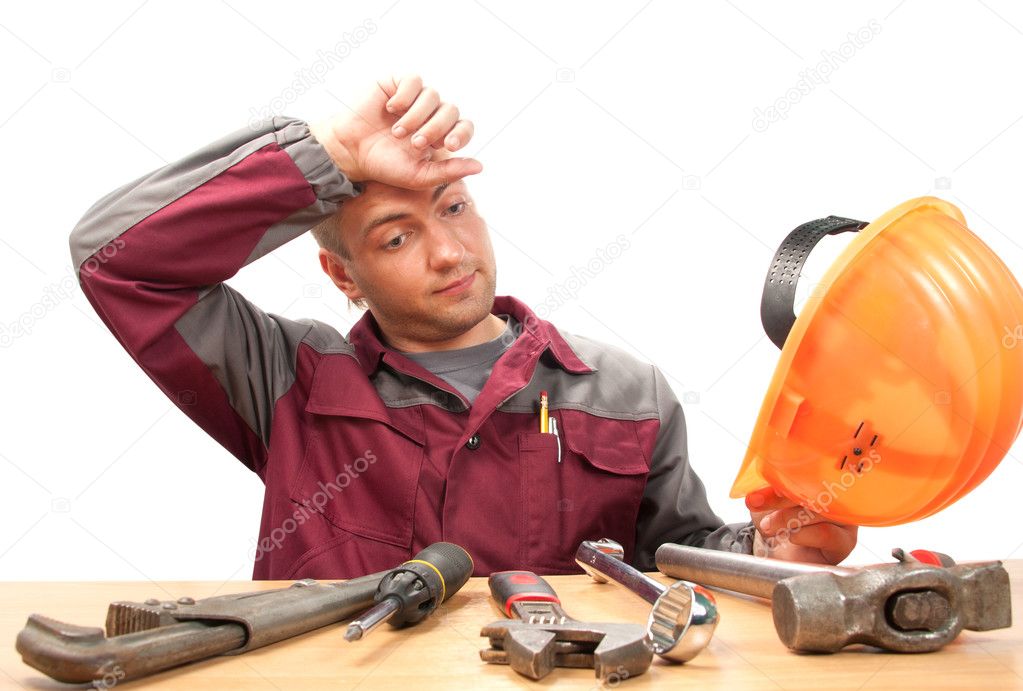 Tired working man with tools