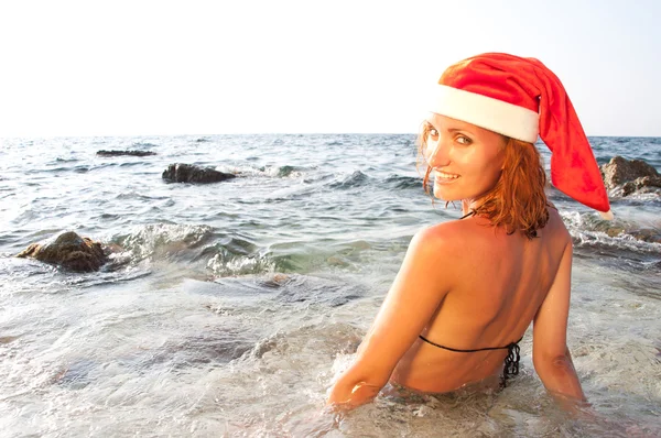 Woman in christmas hat — Stock Photo, Image