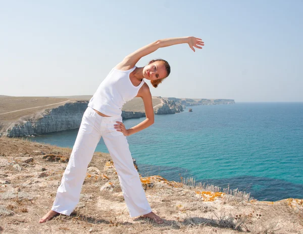 Woman practices Yoga — Stock Photo, Image
