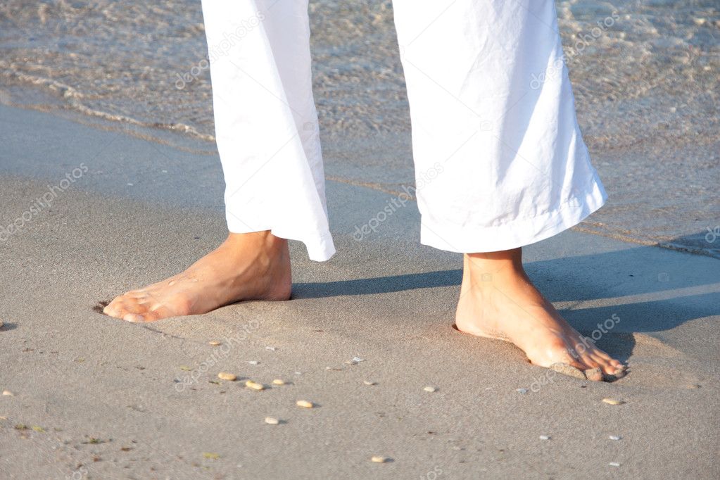 Woman walking barefoot on the beach — Stock Photo © Nomadsoul1 #3733136