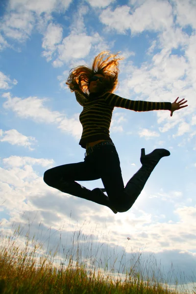 Playful woman jumping — Stock Photo, Image